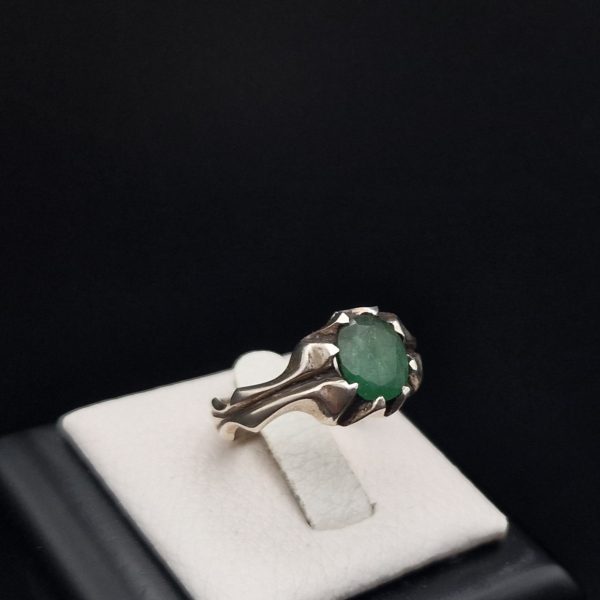 view of an emerald silver ring for men by haidar and co jewelry boutique